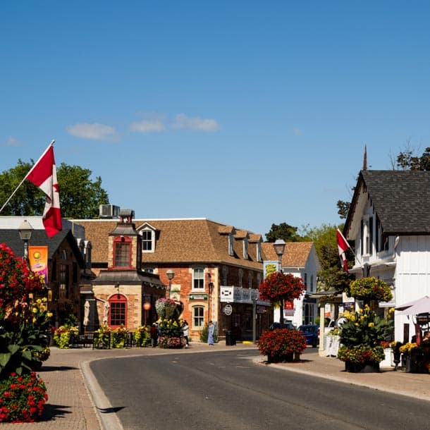 Historic Main Street Unionville with charming shops and Canadian flags